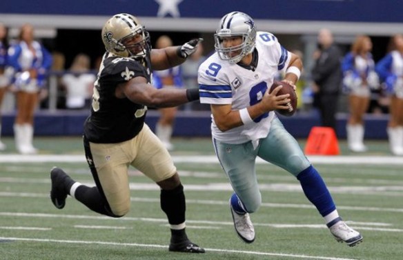 dallas-cowboys-quarterback-tony-romo-9-runs-from-new-orleans-saints-defensive-tackle-tom-johnson1