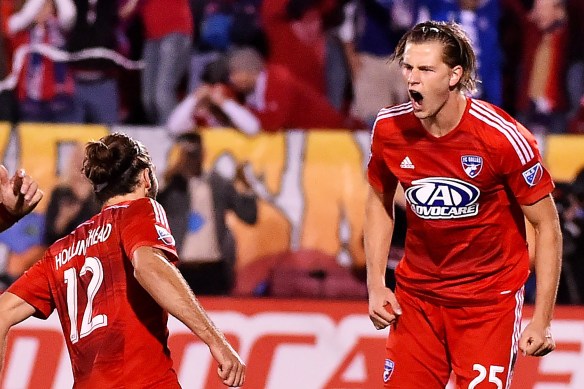 Nov 8, 2015; Dallas, TX, USA; FC Dallas defender Walker Zimmerman (25) celebrates with teammates after kicking the game winning goal past Seattle Sounders FC goalkeeper Stefan Frei (not pictured) to defeat Seattle Sounders FC 4-2 during the penalty kicks in the MLS Playoffs at Toyota Stadium. FC Dallas. Mandatory Credit: Jasen Vinlove-USA TODAY Sports